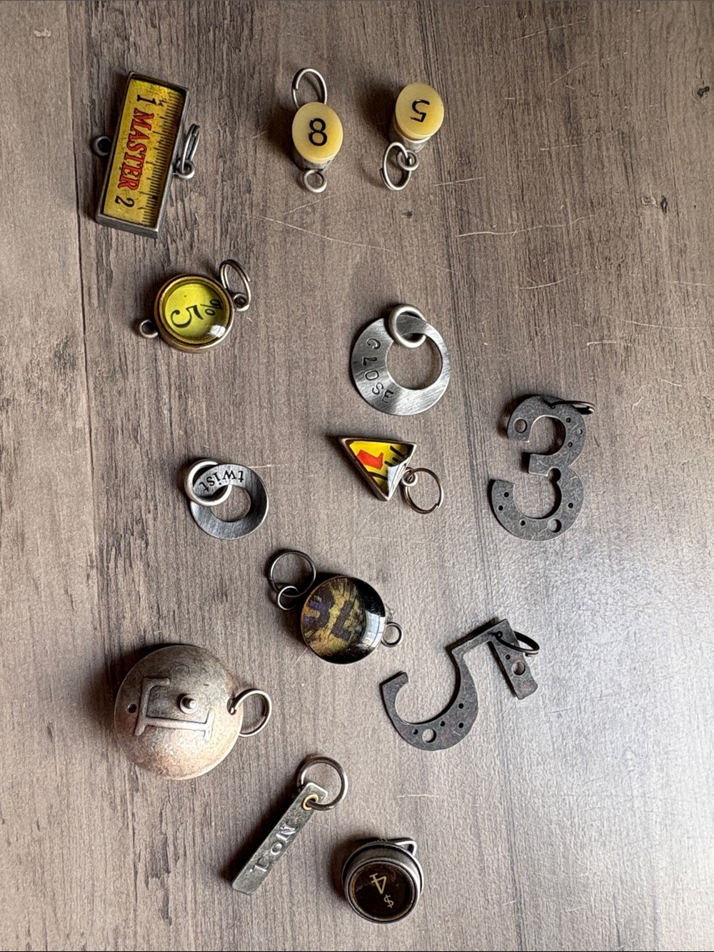 Mixed Men’s Jewelry Charms in Yellow and Metal Tones Industrial Style